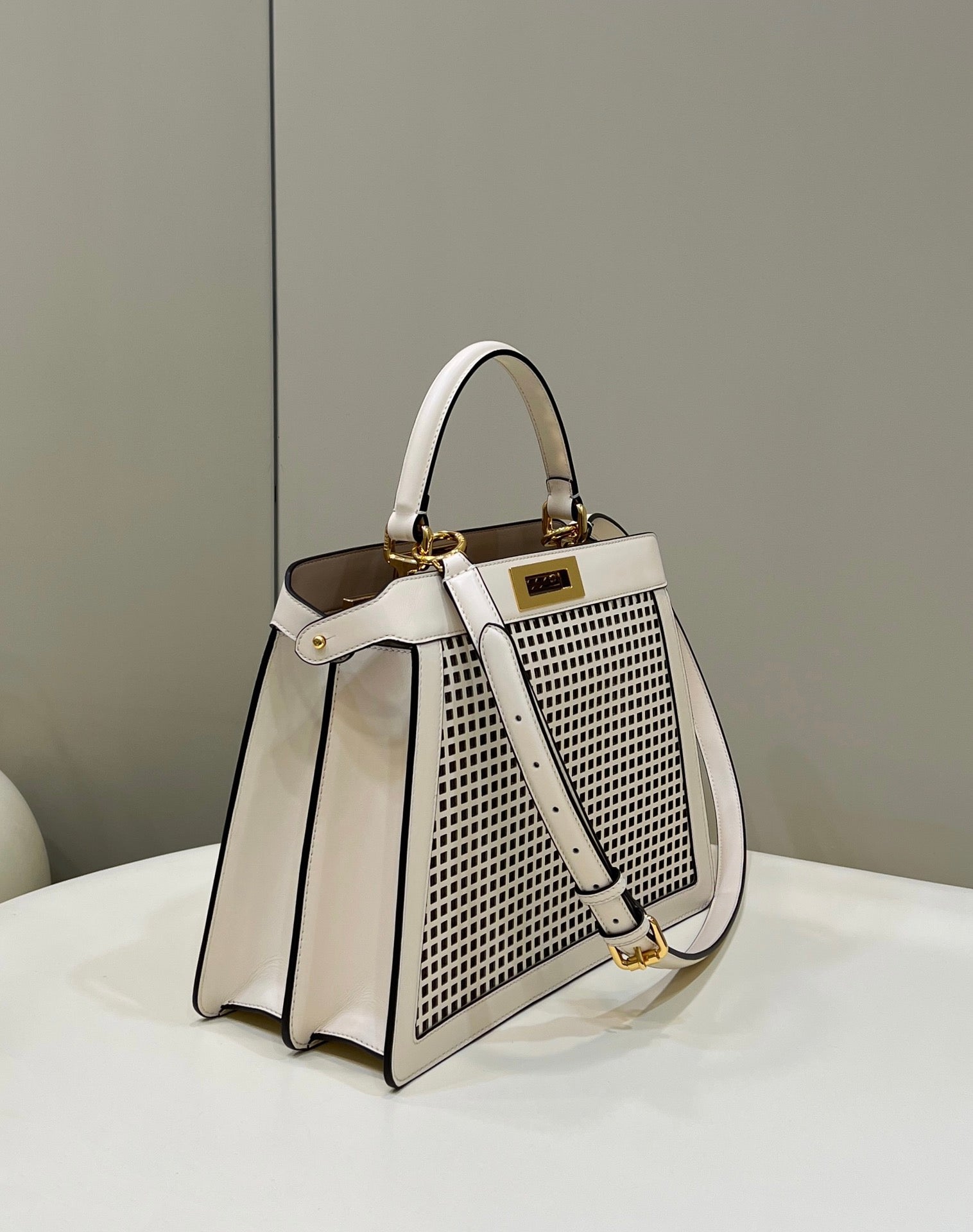 PEEKABOO ISEEU 34 IN WHITE PERFORATED CALFSKIN GOLD HARDWARE