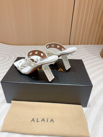 ALAIA TWO-STRAPS HIGH HEEL SANDALS IN WHITE PATENT LAMBSKIN