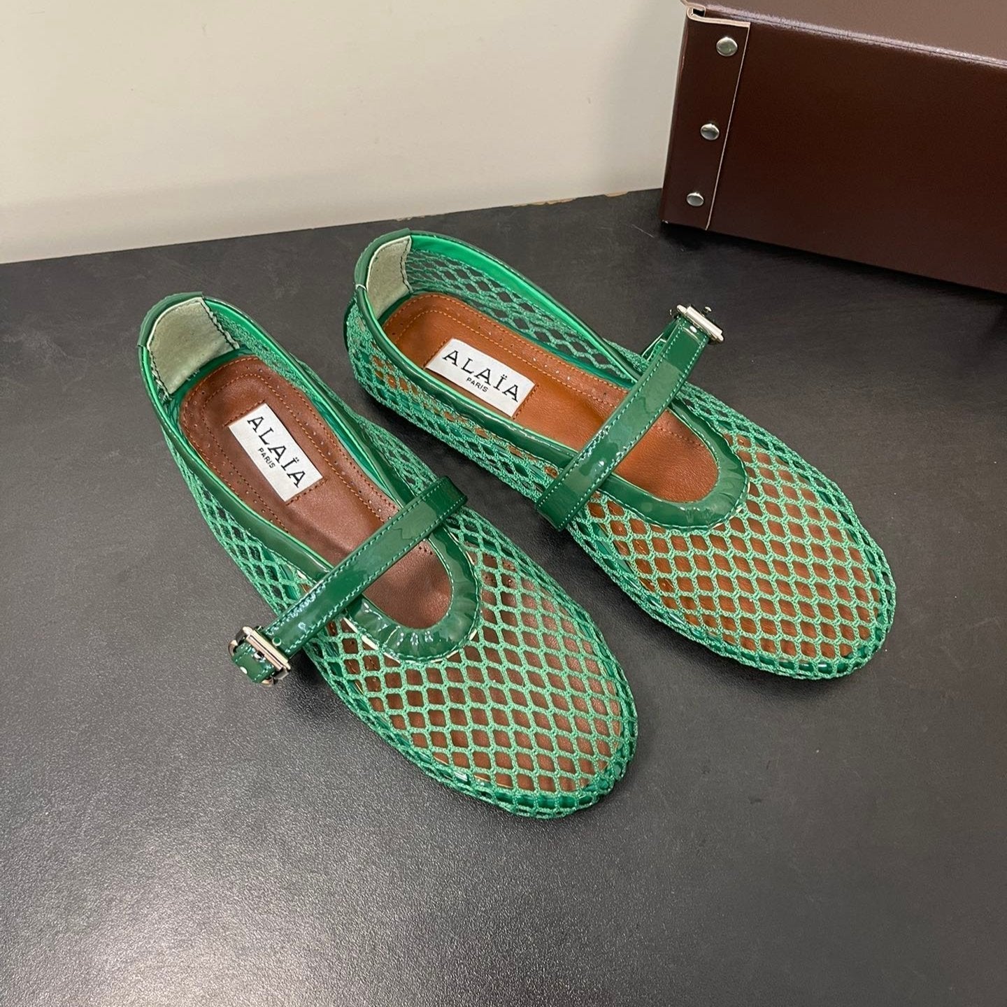 ALAIA BALLET FLATS IN COOL GREEN MESH FISHNET