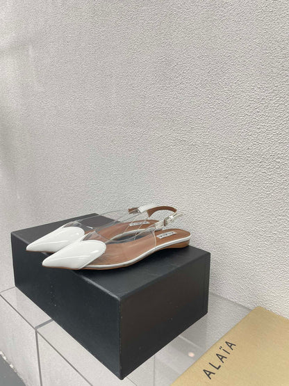 ALAIA LE COEUR FLAT SLINGBACKS IN WHITE PATENT LAMBSKIN