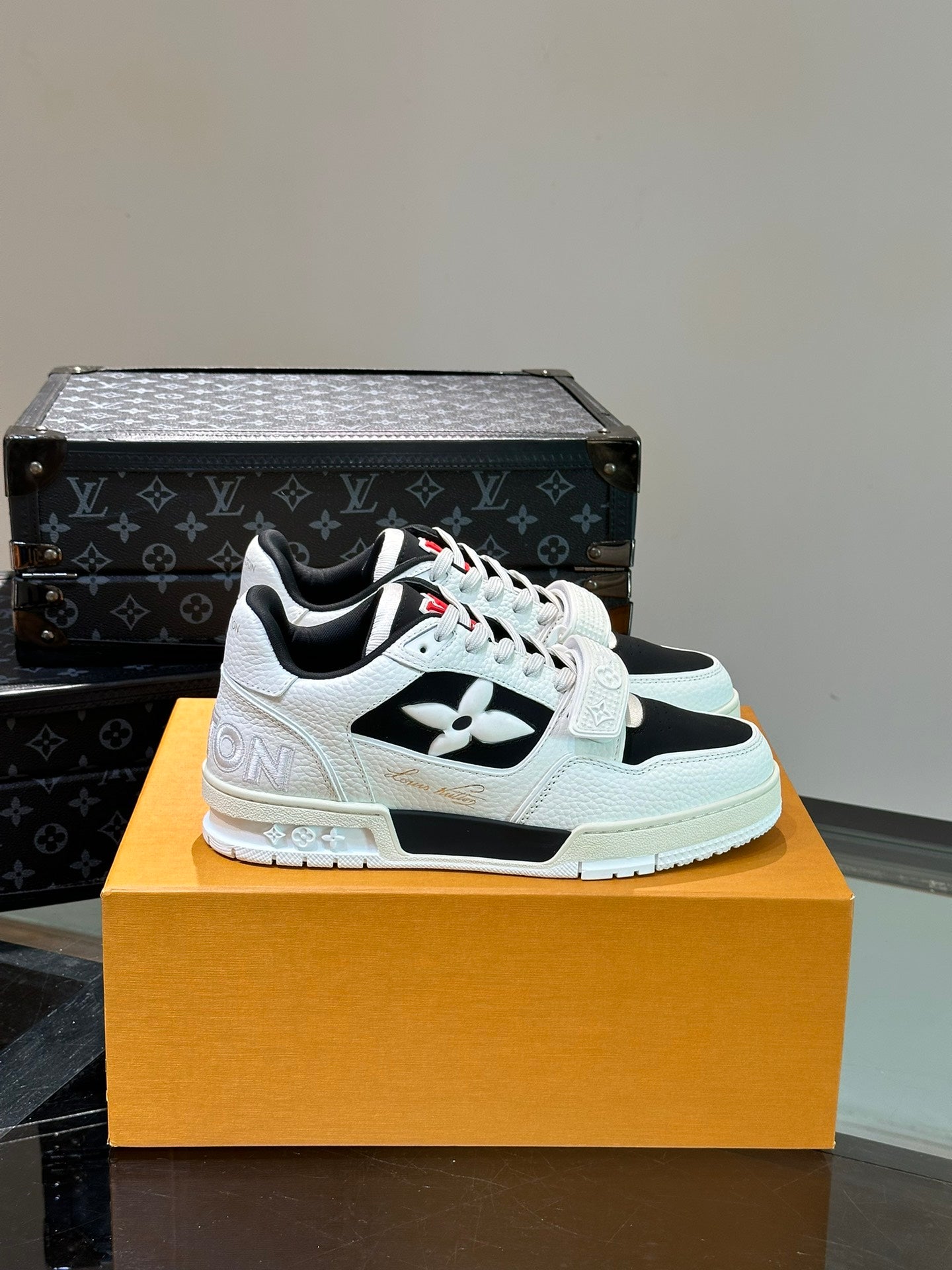 LV TRAINER SNEAKERS IN WHITE CALFSKIN AND BLACK SUEDE