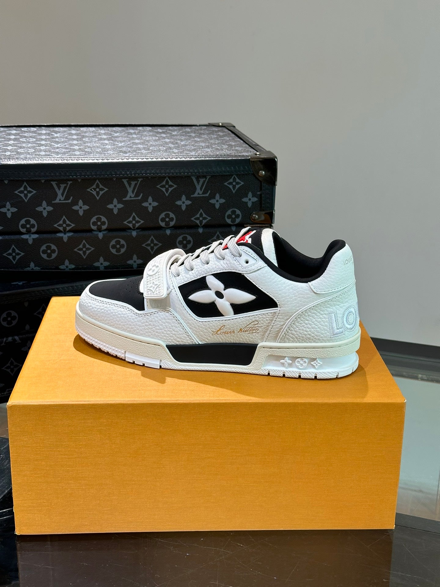 LV TRAINER SNEAKERS IN WHITE CALFSKIN AND BLACK SUEDE