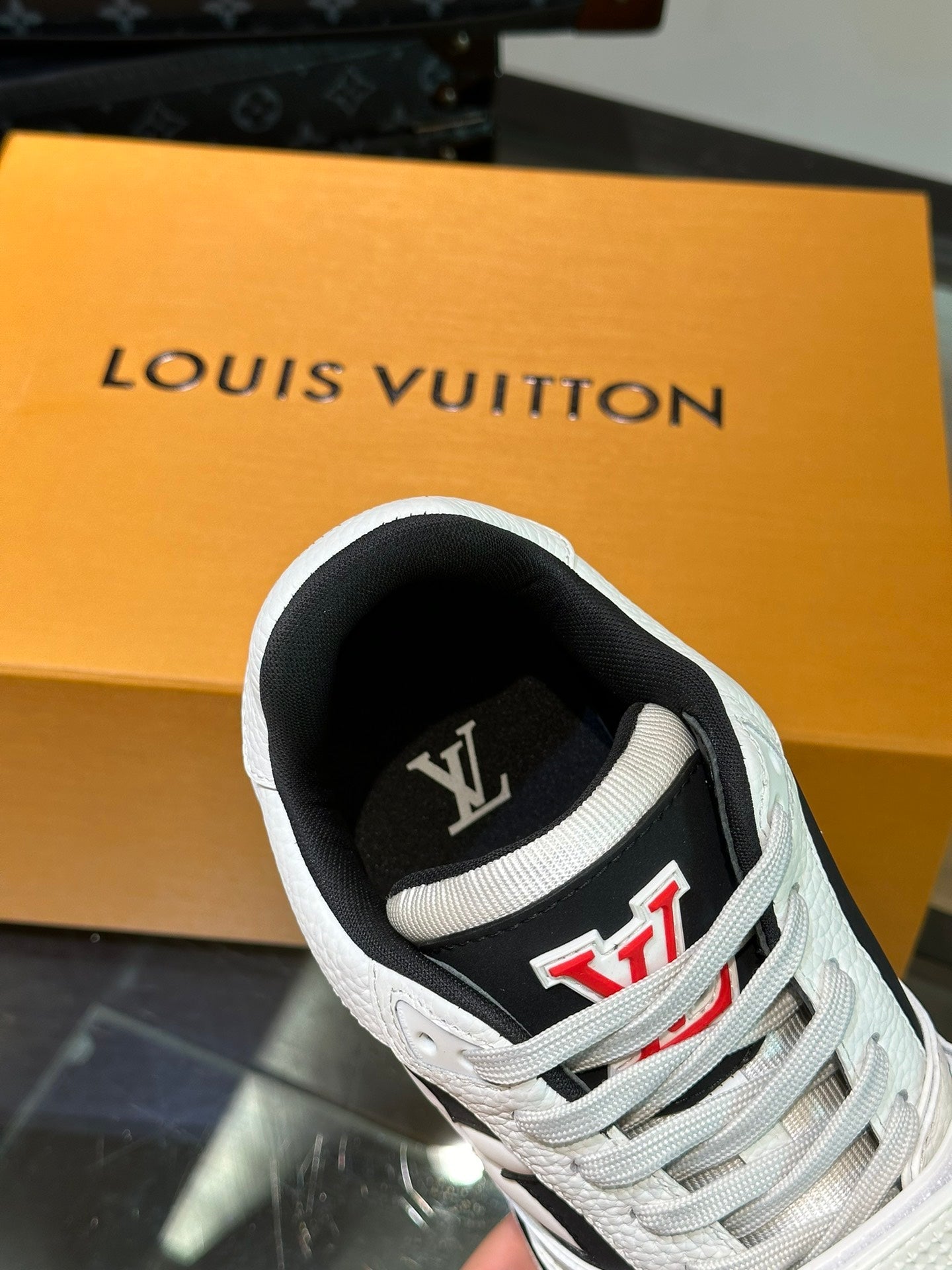 LV TRAINER SNEAKERS IN WHITE CALFSKIN AND BLACK SUEDE